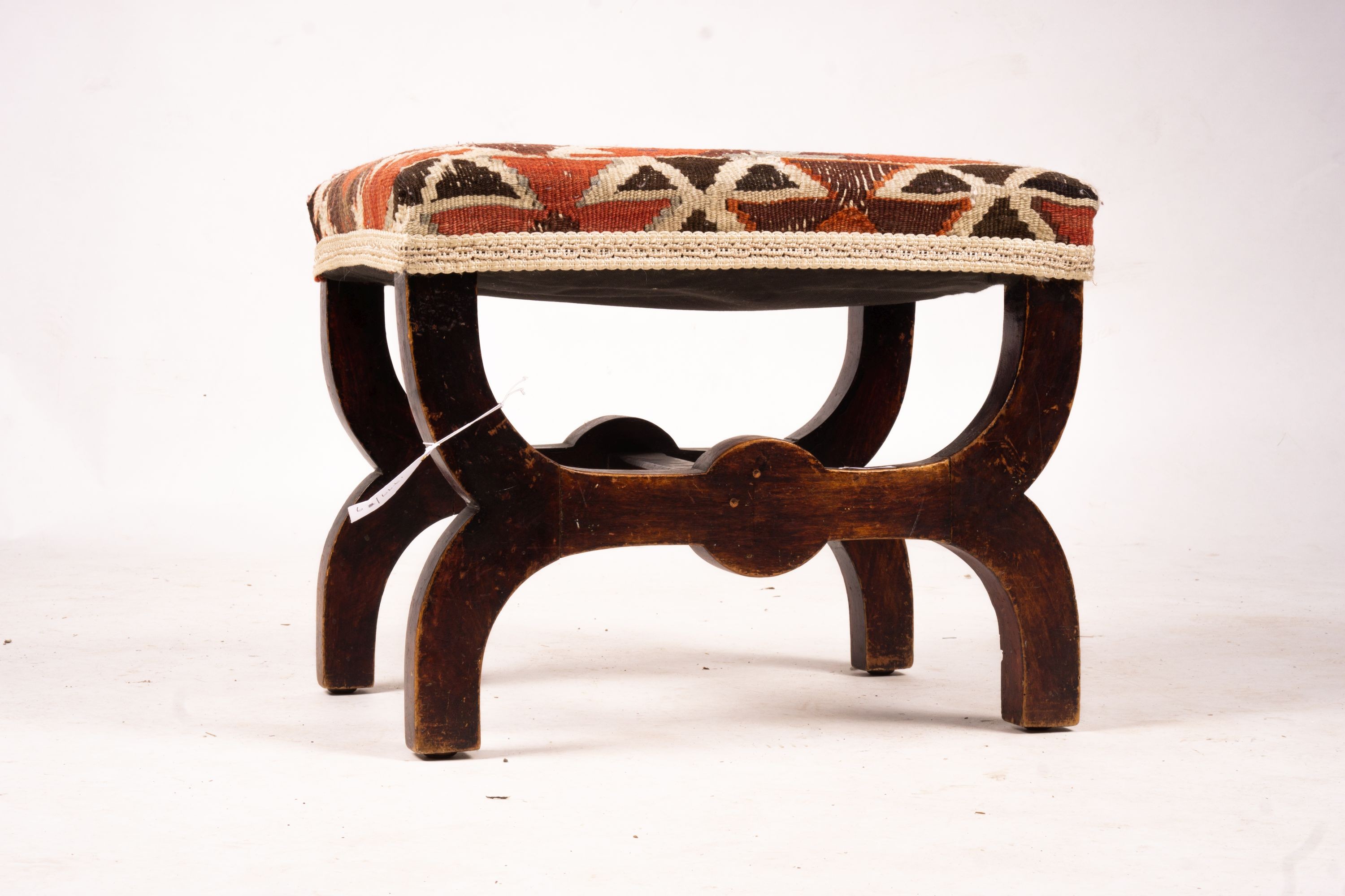 A Victorian beech 'X' framed stool with Kelim seat, length 48cm, depth 35cm, height 37cm